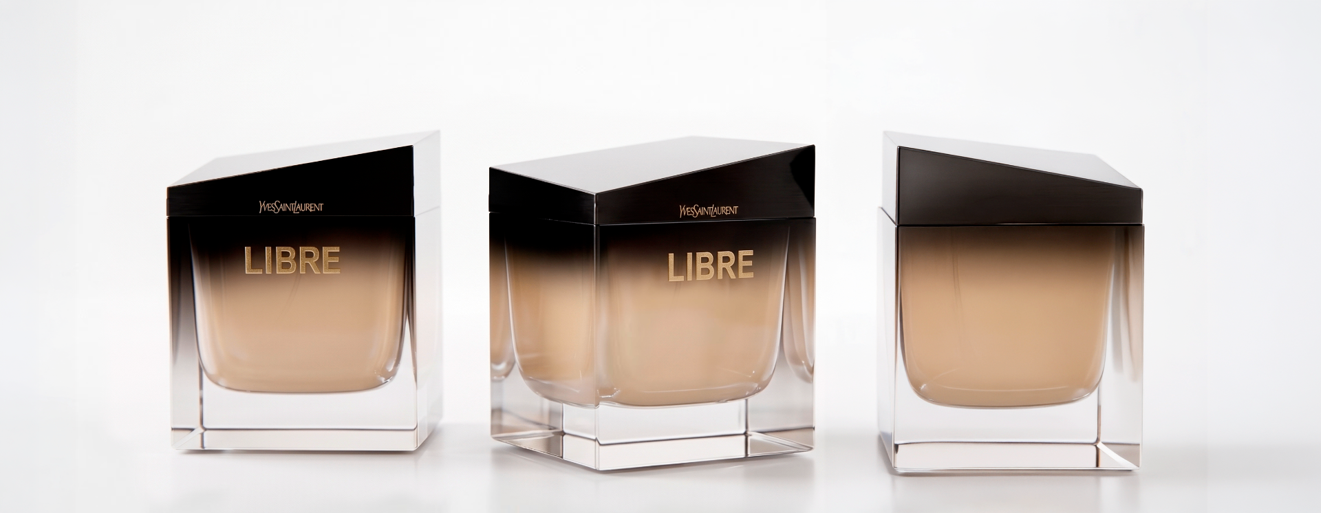 Dégradé fumé — trois flacons LIBRE, capot noir et verre dépoli